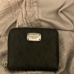 This is a black Michael Kors wallet.